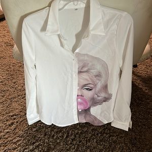 New. Classic Oxford style blouse with Marilyn Monroe look. Light soft polyester.